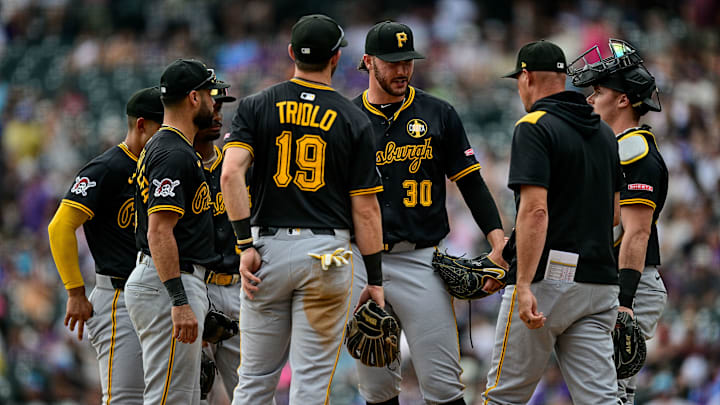 MLB: Pirates at Rockies — Paul Skenes and Don Kelly meet at the mound.