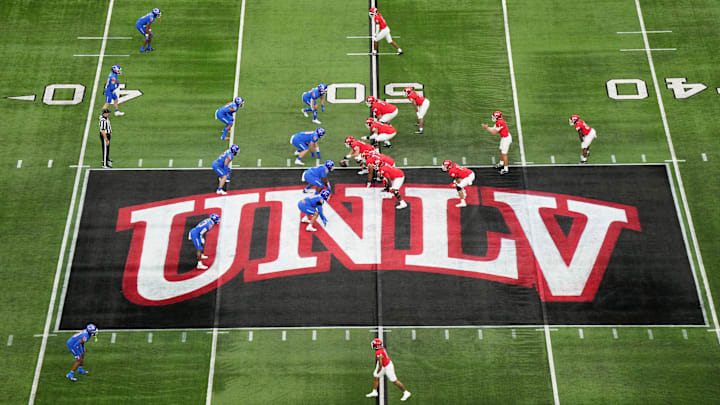 A general overall view as UNLV Rebels quarterback Jayden Maiava (1) takes the snap on the UNLV logo at midfield against the Boise State Broncos in the first half during the Mountain West Championship at Allegiant Stadium. Mandatory Credit: Kirby Lee-Imagn Images A general overall view as UNLV Rebels quarterback Jayden Maiava (1) takes the snap on the UNLV logo at midfield against the Boise State Broncos in the first half during the Mountain West Championship at Allegiant Stadium. Mandatory Credit: Kirby Lee-Imagn Images