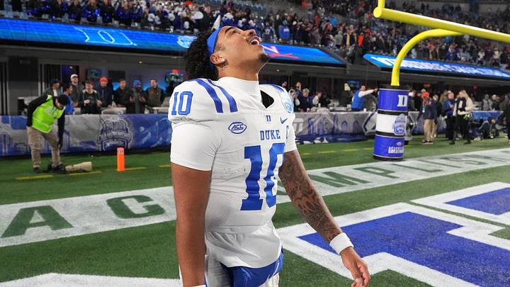 Dec 6, 2025; Charlotte, NC, USA; Duke Blue Devils quarterback Darian Mensah (10) reacts after winning the  ACC Championship game at Bank of America Stadium. Mandatory Credit: Bob Donnan-Imagn Images