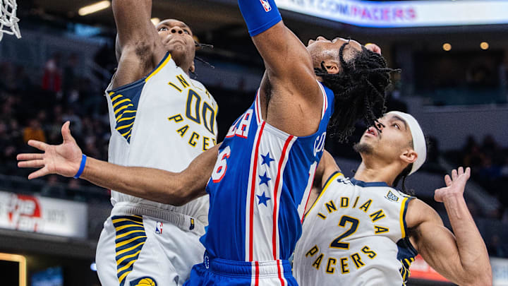 Jan 25, 2024; Indianapolis, Indiana, USA; Philadelphia 76ers guard Ricky Council IV (16) shoots the ball while Indiana Pacers guard Bennedict Mathurin (00) and guard Andrew Nembhard (2) defend in the second half at Gainbridge Fieldhouse. Mandatory Credit: Trevor Ruszkowski-Imagn Images Jan 25, 2024; Indianapolis, Indiana, USA; Philadelphia 76ers guard Ricky Council IV (16) shoots the ball while Indiana Pacers guard Bennedict Mathurin (00) and guard Andrew Nembhard (2) defend in the second half at Gainbridge Fieldhouse. Mandatory Credit: Trevor Ruszkowski-Imagn Images
