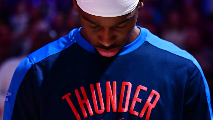 Jan 8, 2025; Cleveland, Ohio, USA; Oklahoma City Thunder guard Shai Gilgeous-Alexander (2) listens to the national anthem before the game between the Cleveland Cavaliers and the Thunder at Rocket Mortgage FieldHouse. Mandatory Credit: Ken Blaze-Imagn Images