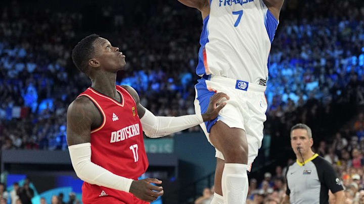 Aug 8, 2024; Paris, France; France power forward Guerschon Yabusele (7) shoots the ball over Germany point guard Dennis Schroder (17) during the second half in a men's basketball semifinal game during the Paris 2024 Olympic Summer Games at Accor Arena. Mandatory Credit: Kyle Terada-USA TODAY Sports