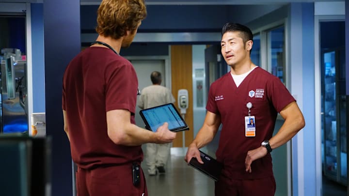 CHICAGO MED -- "Those Things Hidden In Plain Sight" Episode 602 -- Pictured: (l-r) Nick Gehlfuss as Dr. Will Halstead, Brian Tee as Ethan Choi -- (Photo by: Elizabeth Sisson/NBC)