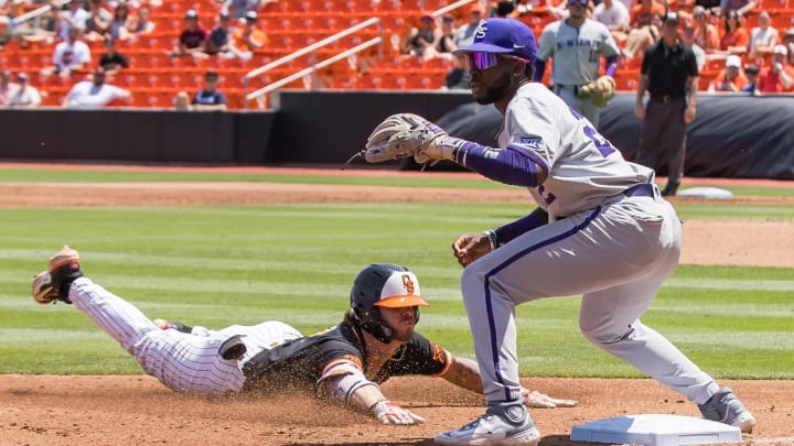 May 13, 2023; Stillwater, OK, USA; Oklahoma State Cowboys second baseman Roc Riggio (7) slides into third base ahead of the throw to Kansas State Wildcats infielder Kaelen Culpepper (22). Mandatory Credit: Brett Rojo-USA TODAY Sports