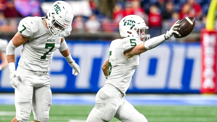 Forest Hills Central's Ty Hudkins celebrates his interception during the second quarter in the game against Mason on Sunday, Nov. 26, 2023, at Ford Field in Detroit.