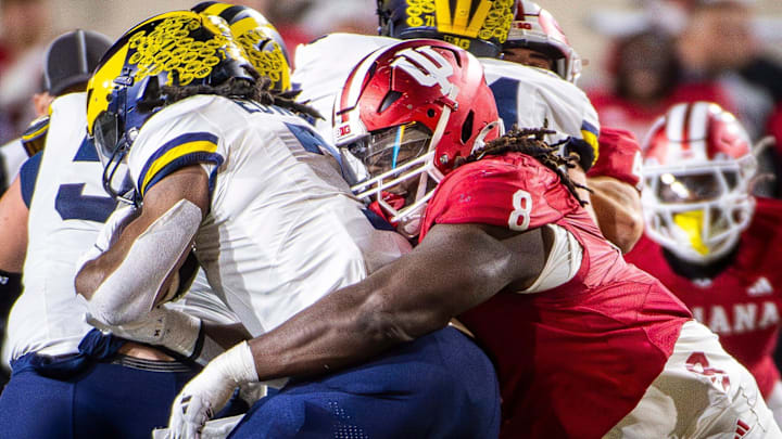 Indiana's CJ West tackles Michigan's Donovan Edwards at Memorial Stadium on Saturday, Nov. 9, 2024. Indiana's CJ West tackles Michigan's Donovan Edwards at Memorial Stadium on Saturday, Nov. 9, 2024.
