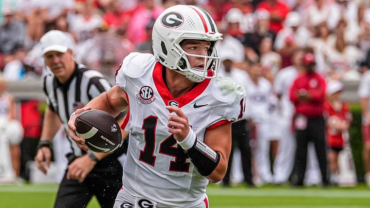 Sep 12, 2026; Athens, Georgia, USA; Georgia Bulldogs quarterback Gunner Stockton (14) rolls out and runs against the Western Kentucky Hilltoppers during the first half at Sanford Stadium. Mandatory Credit: Dale Zanine-Imagn Images