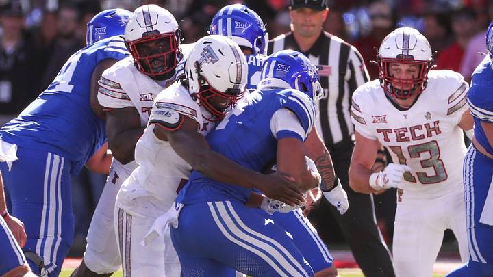 Texas Tech's David Bailey wraps up the BYU ball carrier during a Big 12 Conference football game, Saturday, Nov. 8, at Jones AT&T Stadium. Texas Tech's David Bailey wraps up the BYU ball carrier during a Big 12 Conference football game, Saturday, Nov. 8, at Jones AT&T Stadium.