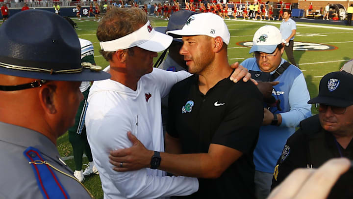 Sep 20, 2025; Oxford, Mississippi, USA; Mississippi Rebels head coach Lane Kiffin (left) and Tulane Green Wave head coach Jon Sumrall (right) embrace after the game at Vaught-Hemingway Stadium. Mandatory Credit: Petre Thomas-Imagn Images Sep 20, 2025; Oxford, Mississippi, USA; Mississippi Rebels head coach Lane Kiffin (left) and Tulane Green Wave head coach Jon Sumrall (right) embrace after the game at Vaught-Hemingway Stadium. Mandatory Credit: Petre Thomas-Imagn Images