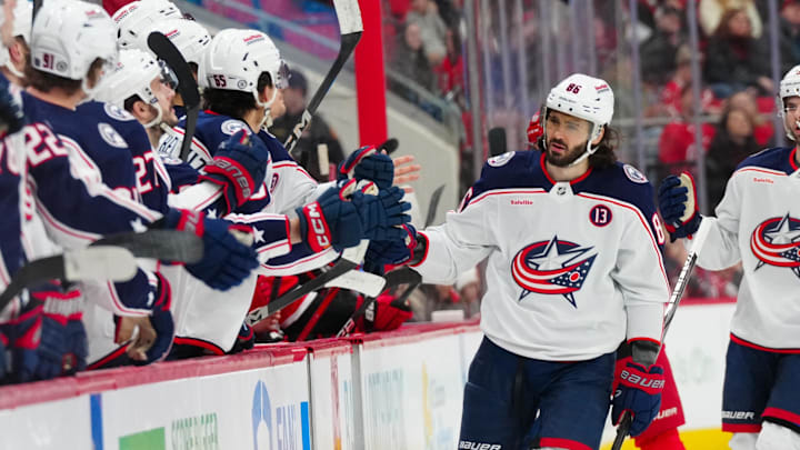 Jan 23, 2025; Raleigh, North Carolina, USA; Columbus Blue Jackets right wing Kirill Marchenko (86) celebrates his goal against the Carolina Hurricanes during the first period at Lenovo Center. Mandatory Credit: James Guillory-Imagn Images Jan 23, 2025; Raleigh, North Carolina, USA; Columbus Blue Jackets right wing Kirill Marchenko (86) celebrates his goal against the Carolina Hurricanes during the first period at Lenovo Center. Mandatory Credit: James Guillory-Imagn Images