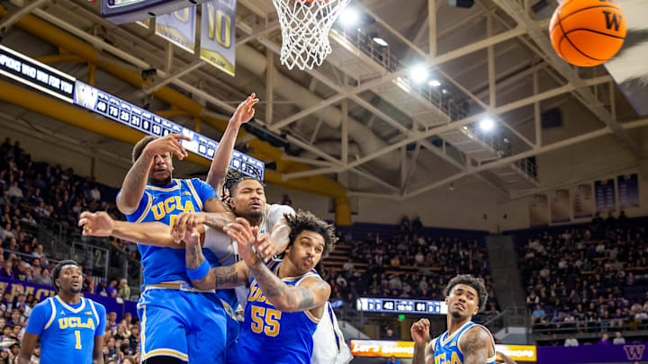 Lathan Sommerville and a host of UCLA players battle for the ball. 