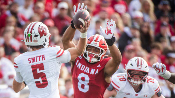 Indiana's Stephen Daly (8) pressures Wisconsin's Carter Smith (5) during the Indiana versus Wisconsin football game at Memorial Stadium on Saturday, Nov. 15, 2025.