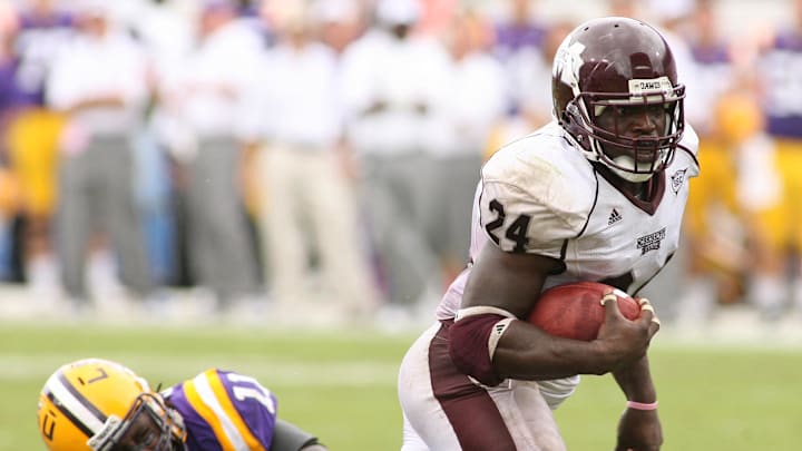 September 26, 2009; Starkville, MS, USA; Mississippi State running back Anthony Dixon (24) carries against LSU linebacker Kelvin Sheppard (11) during 2nd half at Davis Wade Stadium. LSU defeated Mississippi State 30-26. Mandatory Credit: John David Mercer-USA TODAY Sports