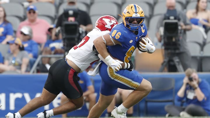 Sep 21, 2024; Pittsburgh, Pennsylvania, USA; Pittsburgh Panthers tight end Gavin Bartholomew (86) runs after a catch against the Youngstown State Penguins during the third quarter at Acrisure Stadium. Mandatory Credit: Charles LeClaire-Imagn Images
