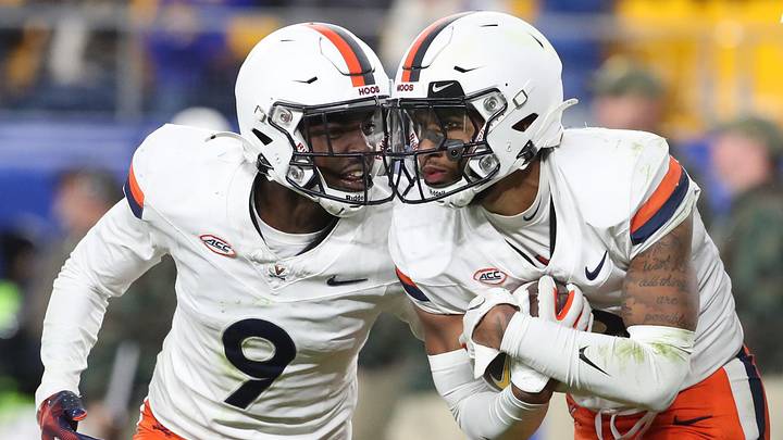 Nov 9, 2024; Pittsburgh, Pennsylvania, USA; Virginia Cavaliers cornerback Jam Jackson (9) and safety Corey Thomas Jr. (right) celebrate an interception by Thomas against the Pittsburgh Panthers during the fourth quarter at Acrisure Stadium. Mandatory Credit: Charles LeClaire-Imagn Images Nov 9, 2024; Pittsburgh, Pennsylvania, USA; Virginia Cavaliers cornerback Jam Jackson (9) and safety Corey Thomas Jr. (right) celebrate an interception by Thomas against the Pittsburgh Panthers during the fourth quarter at Acrisure Stadium. Mandatory Credit: Charles LeClaire-Imagn Images