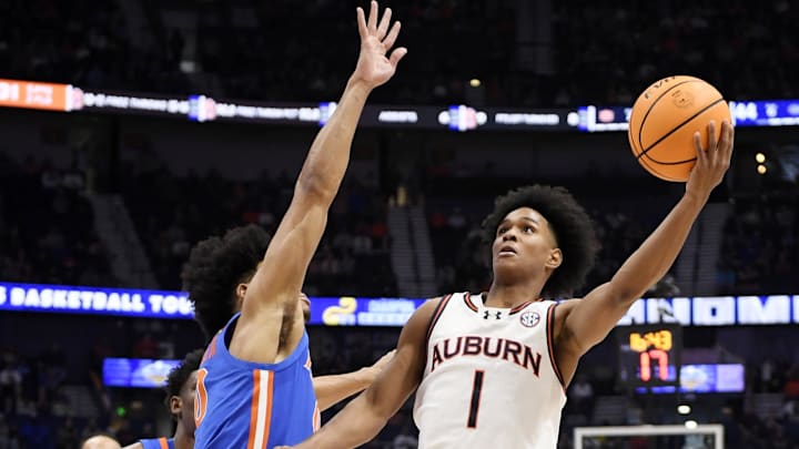 Mar 17, 2024; Nashville, TN, USA; Auburn Tigers guard Aden Holloway (1) shoots against Florida in the SEC men's basketball Championship.