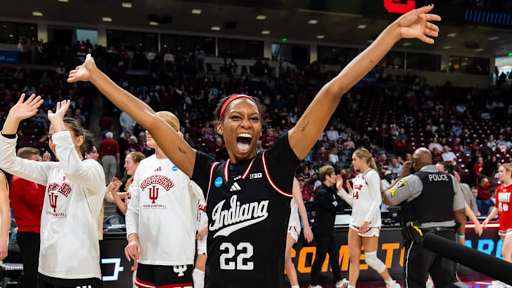 Indiana Hoosiers guard Chloe Moore-McNeil (22) celebrates with teammates following their 76-68 win over the Utah Utes at Colonial Life Arena.