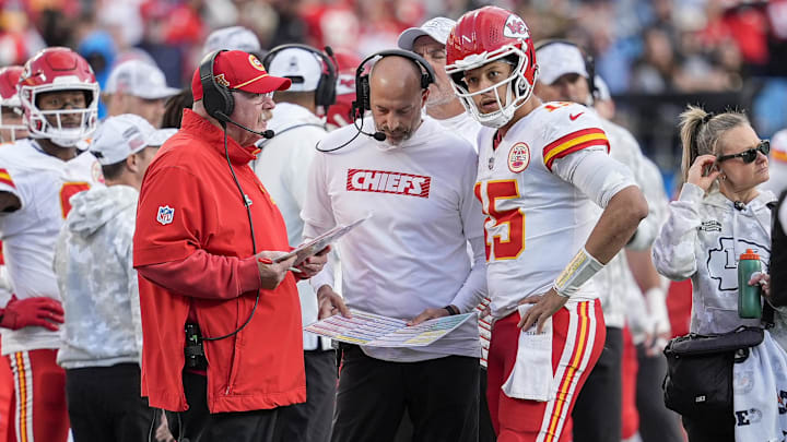 Nov 24, 2024; Charlotte, North Carolina, USA;  Kansas City Chiefs head coach Andy Reid talks with quarterback Patrick Mahomes (15) during a time out during the second half against the Carolina Panthers at Bank of America Stadium. Mandatory Credit: Jim Dedmon-Imagn Images