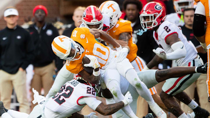 Tennessee wide receiver Squirrel White (10) is brought down by Georgia defensive back Javon Bullard (22) during a football game between Tennessee and Georgia at Neyland Stadium in Knoxville, Tenn., on Saturday, Nov. 18, 2023.
