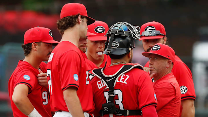 Georgia coach Wes Johnson huddles up his team during a NCAA Athens Regional baseball game against UNCW in Athens, Ga., on Saturday, June 1, 2024. Georgia won 11-2.