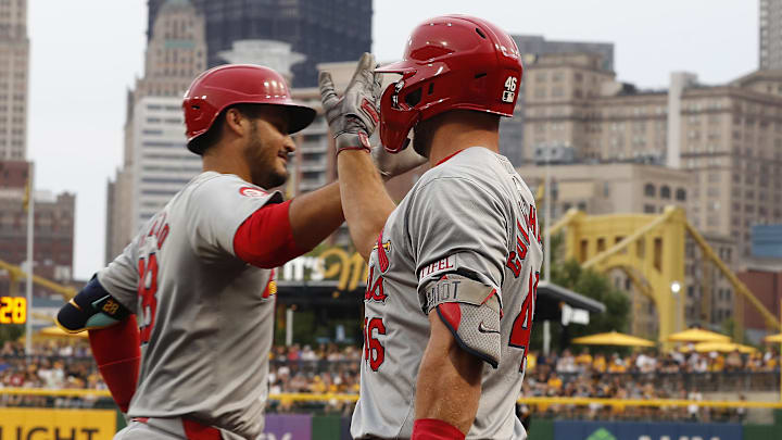 Jul 23, 2024; Pittsburgh, Pennsylvania, USA;  St. Louis Cardinals first baseman Paul Goldschmidt (46)  congratulates third baseman Nolan Arenado (left) on his solo home run against the Pittsburgh Pirates during the fifth inning at PNC Park. Mandatory Credit: Charles LeClaire-Imagn Images