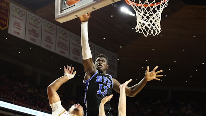 Mar 4, 2025; Ames, Iowa, USA; Brigham Young Cougars center Keba Keita (13) blocks the shot from Iowa State Cyclones guard Tamin Lipsey (3) at James H. Hilton Coliseum. Mandatory Credit: Reese Strickland-Imagn Images Mar 4, 2025; Ames, Iowa, USA; Brigham Young Cougars center Keba Keita (13) blocks the shot from Iowa State Cyclones guard Tamin Lipsey (3) at James H. Hilton Coliseum. Mandatory Credit: Reese Strickland-Imagn Images
