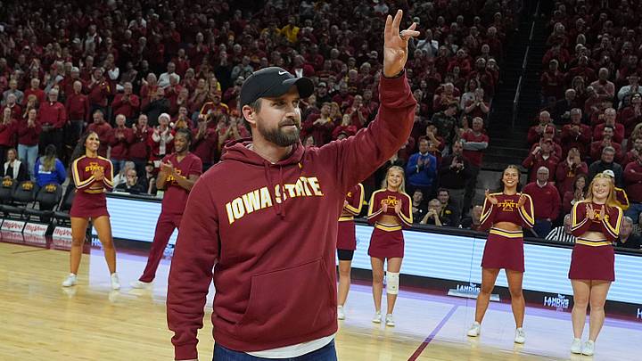 Iowa State football coach Jimmy Rogers speaks during a timeout in the first half in the Iowa State and Iowa men’s basketball Cy-Hawk series at Hilton coliseum on Dec. 11, 2025, in Ames, Iowa. Iowa State football coach Jimmy Rogers speaks during a timeout in the first half in the Iowa State and Iowa men’s basketball Cy-Hawk series at Hilton coliseum on Dec. 11, 2025, in Ames, Iowa.