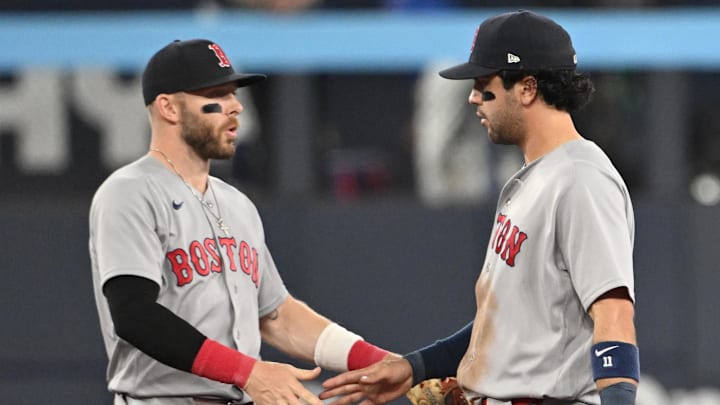 Apr 27, 2026; Toronto, Ontario, CAN;  Boston Red Sox shortstop Trevor Story (10, left) and second baseman Marcelo Mayer (11) celebrate after a win over the Toronto Blue Jays at Rogers Centre. Mandatory Credit: Dan Hamilton-Imagn Images