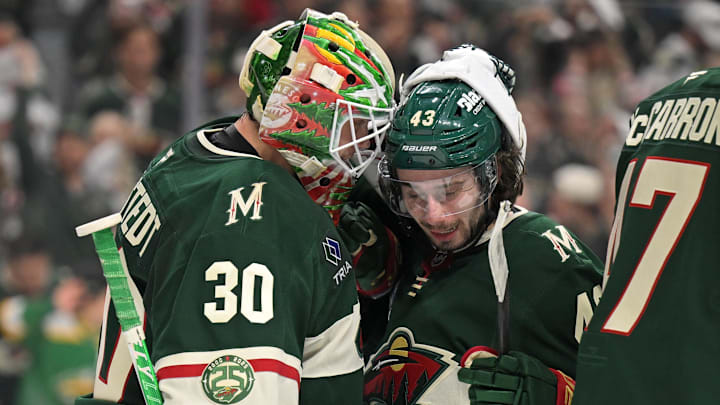 Apr 30, 2026; Saint Paul, Minnesota, USA; Minnesota Wild goalie Jesper Wallstedt (30) and defensemen Quinn Hughes (43) celebrate a series win against the Dallas Stars after game six of the first round of the 2026 Stanley Cup Playoffs at Grand Casino Arena. Mandatory Credit: Nick Wosika-Imagn Images