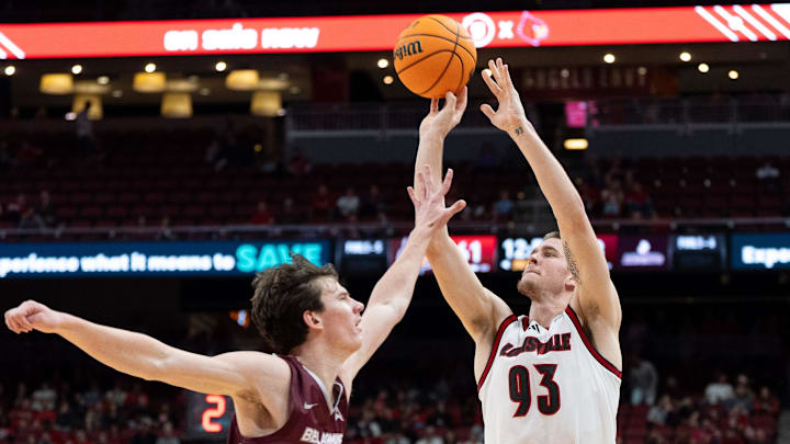 Louisville Cardinals forward Noah Waterman (93) attempts a jump shot against Bellarmine Knights guard Tyler Doyle (2) during their game on Tuesday, Nov. 19, 2024 at the KFC Yum! Center in Louisville, Ky.
