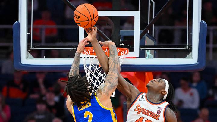Mar 7, 2026; Syracuse, New York, USA; Syracuse Orange forward William Kyle III (42) blocks the dunk attempt of Pittsburgh Panthers forward Cameron Corhen (2) during overtime at the JMA Wireless Dome. Mandatory Credit: Rich Barnes-Imagn Images