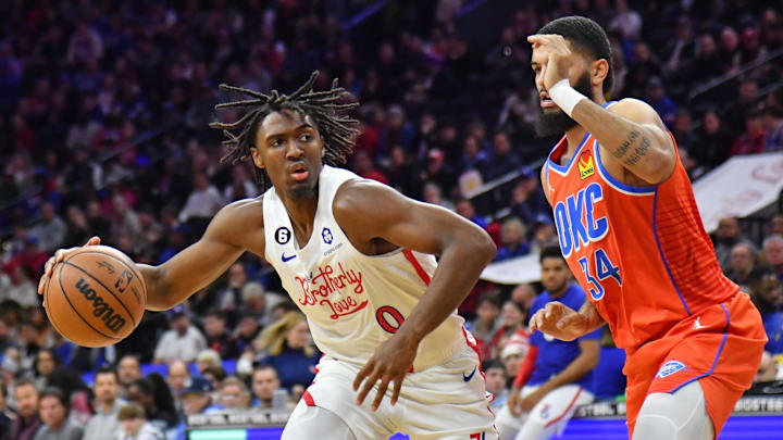Jan 12, 2023; Philadelphia, Pennsylvania, USA; Philadelphia 76ers guard Tyrese Maxey (0) is defended by Oklahoma City Thunder forward Kenrich Williams (34) at Wells Fargo Center. Mandatory Credit: Eric Hartline-Imagn Images