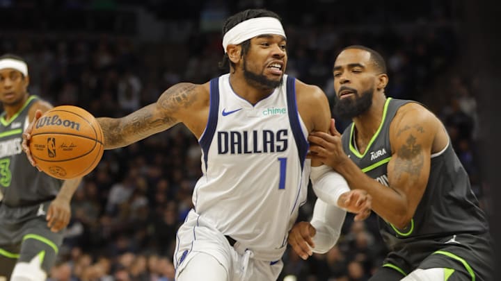Dec 28, 2023; Minneapolis, Minnesota, USA; Dallas Mavericks guard Jaden Hardy (1) works around