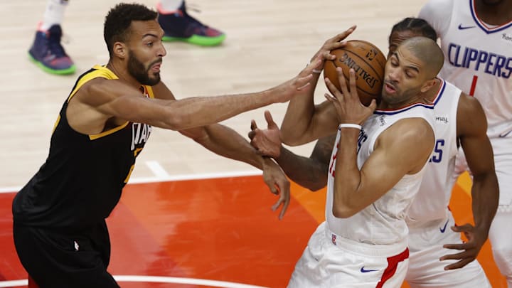Jun 8, 2021; Salt Lake City, Utah, USA; Utah Jazz center Rudy Gobert (27) and LA Clippers forward