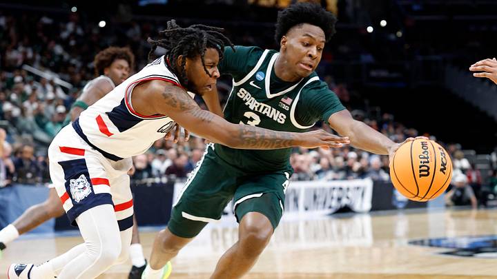 Mar 27, 2026; Washington, DC, USA; Michigan State Spartans forward Cameron Ward (3) dribbles the ball past UConn Huskies guard Malachi Smith (0) in the first half during a Sweet Sixteen game of the East Regional of the men's 2026 NCAA Tournament at Capital One Arena. Mandatory Credit: Amber Searls-Imagn Images Mar 27, 2026; Washington, DC, USA; Michigan State Spartans forward Cameron Ward (3) dribbles the ball past UConn Huskies guard Malachi Smith (0) in the first half during a Sweet Sixteen game of the East Regional of the men's 2026 NCAA Tournament at Capital One Arena. Mandatory Credit: Amber Searls-Imagn Images