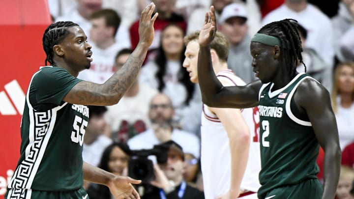Mar 1, 2026; Bloomington, Indiana, USA; Michigan State Spartans forward Coen Carr (55) and Michigan State Spartans guard Kur Teng (2) high-five against the Indiana Hoosiers during the first half at Simon Skjodt Assembly Hall. Mandatory Credit: Robert Goddin-Imagn Images