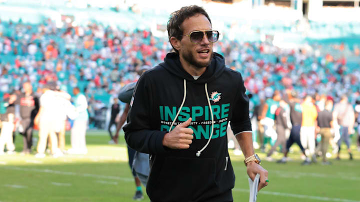 Miami Dolphins head coach Mike McDaniel runs off the field following a win over the Tampa Bay Buccaneers at Hard Rock Stadium. 