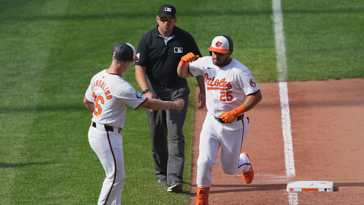 Sep 19, 2024; Baltimore, Maryland, USA; Baltimore Orioles designated hitter Anthony Santander (25) greeted by third base coach Tony Mansolino (36) following his game winning two run home run in the ninth inning against the San Francisco Giants at Oriole Park at Camden Yards. Sep 19, 2024; Baltimore, Maryland, USA; Baltimore Orioles designated hitter Anthony Santander (25) greeted by third base coach Tony Mansolino (36) following his game winning two run home run in the ninth inning against the San Francisco Giants at Oriole Park at Camden Yards.