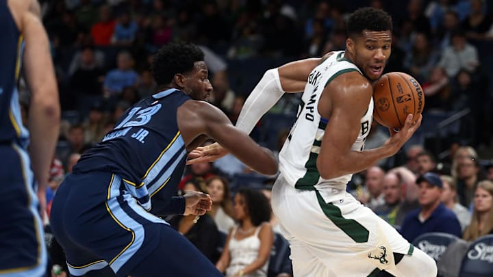 Oct 31, 2024; Memphis, Tennessee, USA; Milwaukee Bucks forward Giannis Antetokounmpo (34) spins around Memphis Grizzlies forward Jaren Jackson Jr. (13) during the first half at FedExForum. Mandatory Credit: Petre Thomas-Imagn Images