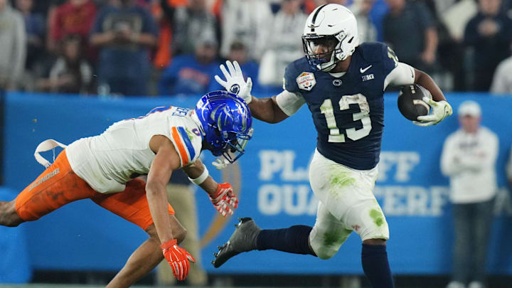 Penn State Nittany Lions running back Kaytron Allen tries to break past Boise State Broncos safety Ty Benefield. Penn State Nittany Lions running back Kaytron Allen tries to break past Boise State Broncos safety Ty Benefield.