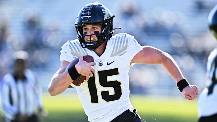 Purdue Boilermakers quarterback Ryan Browne (15) runs the ball Purdue Boilermakers quarterback Ryan Browne (15) runs the ball