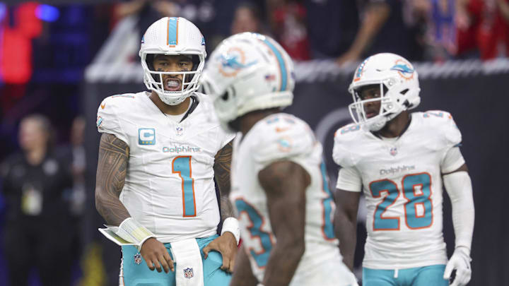 Dec 15, 2024; Houston, Texas, USA; Miami Dolphins quarterback Tua Tagovailoa (1) reacts after a play during the fourth quarter against the Houston Texans at NRG Stadium. Mandatory Credit: Troy Taormina-Imagn Images