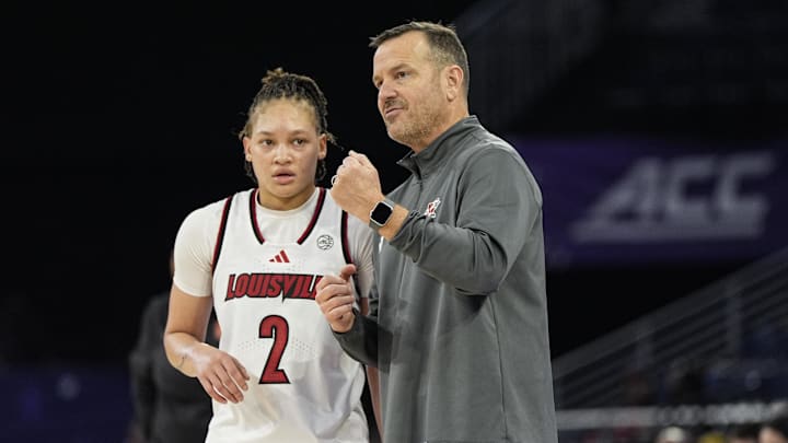 Mar 6, 2026; Duluth, GA, USA; Louisville Cardinals head coach Jeff Walz talks to guard Imari Berry (2) during the game against the Syracuse Orange during the second half at Gas South Arena. Mandatory Credit: Dale Zanine-Imagn Images