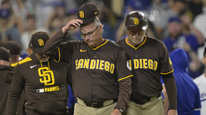 San Diego Padres manager Mike Shildt (8) and third base coach Tim Leiper (33) walk back to the dugout after after benches cleared in the eighth inning against the Los Angeles Dodgers at Dodger Stadium on June 19. San Diego Padres manager Mike Shildt (8) and third base coach Tim Leiper (33) walk back to the dugout after after benches cleared in the eighth inning against the Los Angeles Dodgers at Dodger Stadium on June 19.