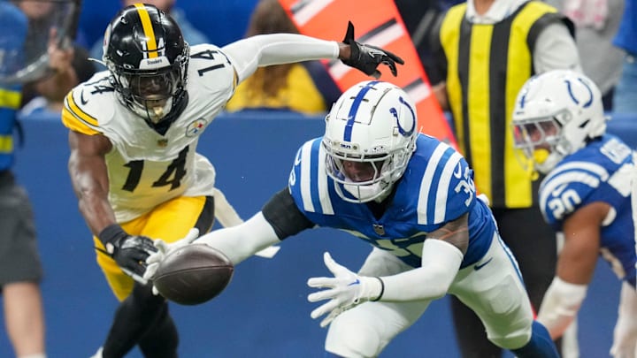 Indianapolis Colts safety Julian Blackmon (32) recovers a ball fumbled by Pittsburgh Steelers wide receiver George Pickens (14) on Sunday, Sept. 29, 2024, during a game against the Pittsburgh Steelers at Lucas Oil Stadium in Indianapolis.