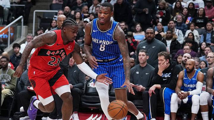 Mar 29, 2026; Toronto, Ontario, CAN; Orlando Magic forward Jamal Cain (8) controls the ball as Toronto Raptors guard Jamal Shead (23) tries to defend during the first quarter at Scotiabank Arena. Mandatory Credit: Nick Turchiaro-Imagn Images