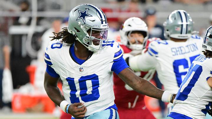 Dallas Cowboys quarterback Joe Milton III hands off in the first half against the Arizona Cardinals at State Farm Stadium. Dallas Cowboys quarterback Joe Milton III hands off in the first half against the Arizona Cardinals at State Farm Stadium.
