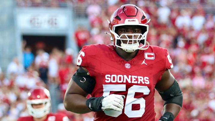 Oklahoma offensive lineman Michael Fasusi runs onto the field before the Sooners' game against New Mexico. Oklahoma offensive lineman Michael Fasusi runs onto the field before the Sooners' game against New Mexico.