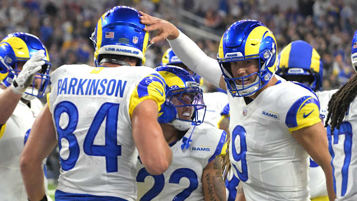 Nov 23, 2025; Inglewood, California, USA; Los Angeles Rams tight end Colby Parkinson (84) is congratulated by quarterback Matthew Stafford (9) after catching a touchdown pass against the Tampa Bay Buccaneers at SoFi Stadium. Mandatory Credit: Jayne Kamin-Oncea-Imagn Images