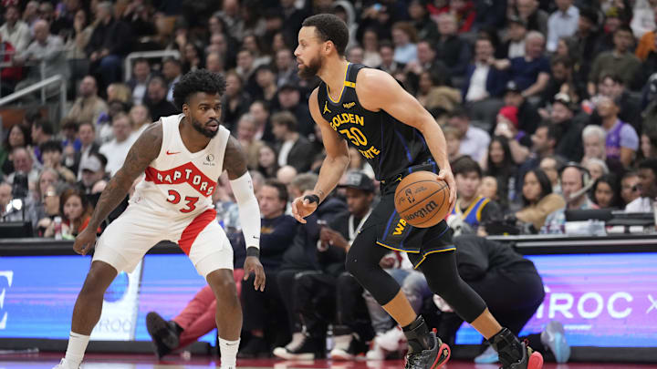 Jan 13, 2025; Toronto, Ontario, CAN; Golden State Warriors guard Stephen Curry (30) dribbles the ball up court as Toronto Raptors guard Jamal Shead (23) defends during the first half at Scotiabank Arena. Mandatory Credit: John E. Sokolowski-Imagn Images Jan 13, 2025; Toronto, Ontario, CAN; Golden State Warriors guard Stephen Curry (30) dribbles the ball up court as Toronto Raptors guard Jamal Shead (23) defends during the first half at Scotiabank Arena. Mandatory Credit: John E. Sokolowski-Imagn Images